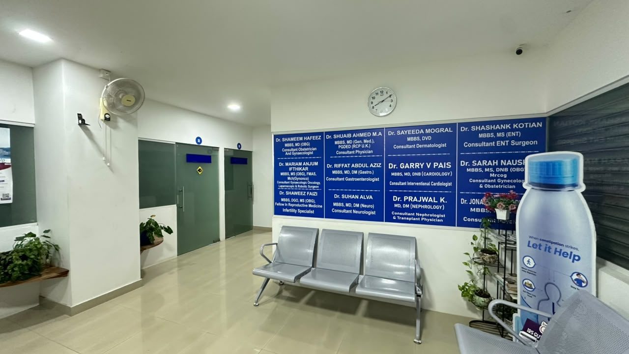 Waiting area with seating and the doctors&rsquo; name board